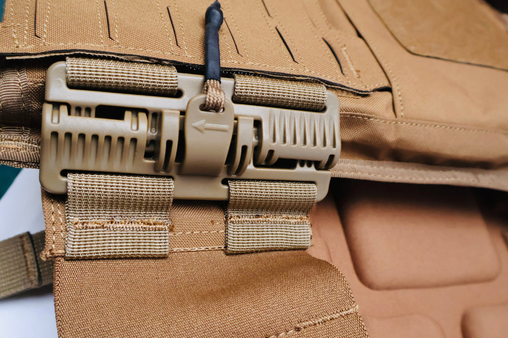 Close-up of a heavy duty QRB Buckle tactical vest with multiple straps and buckles.