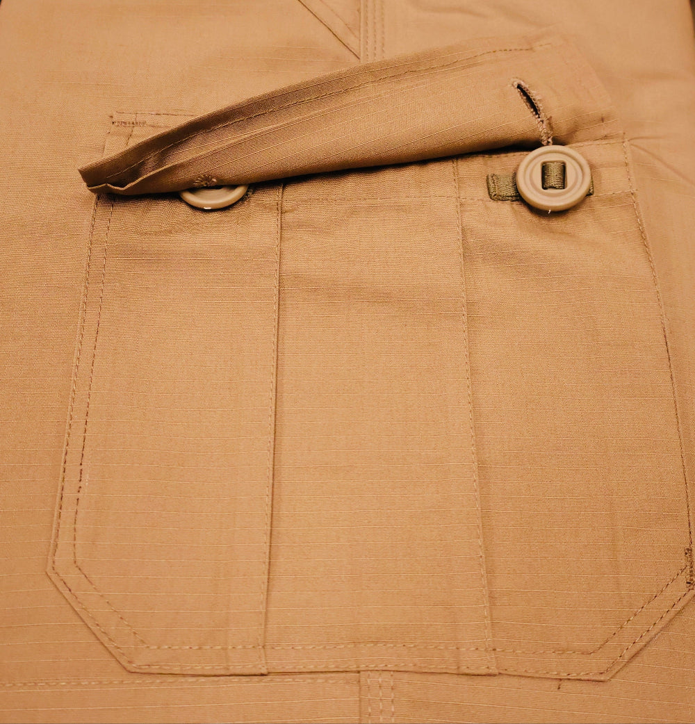 Close-up of a brown pocket with buttons on a matching fabric background