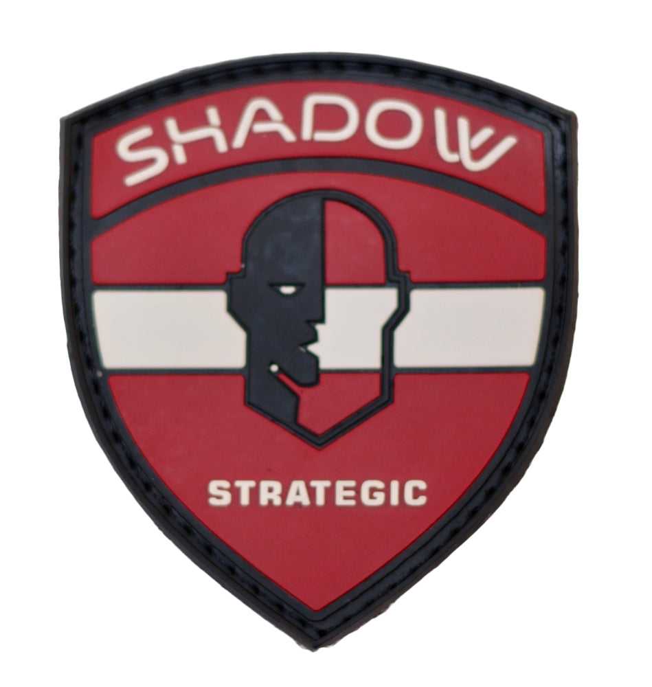Latvia Flag PVC Patch Shield-shaped patch with 'Shadow Strategic' text and silhouette on a red background