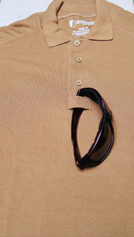 Brown /Coyote polo shirt by Shadow Strategic with a black Sun Glasses on a white background