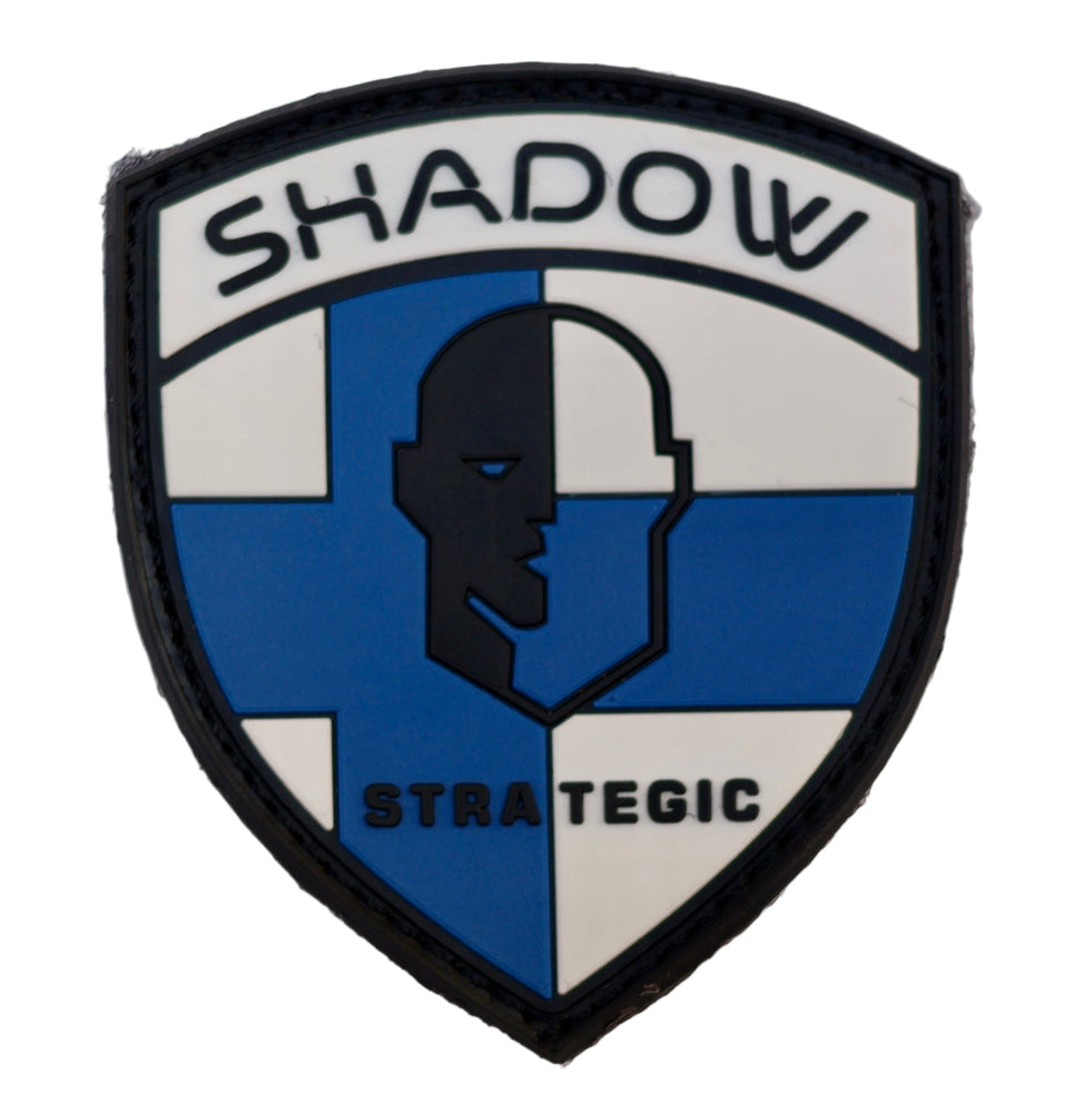 Finland Flag PVC Patch Shield-shaped patch with 'Shadow Strategic' text and a silhouette design on a white background